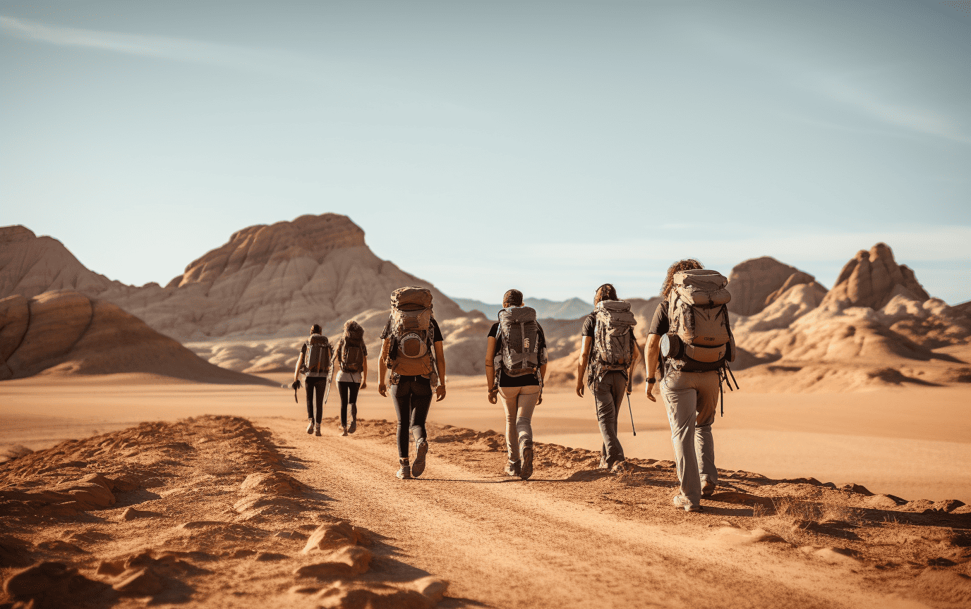 people hiking in the desert